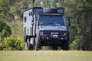 Rugged off-road expedition vehicle with custom living compartment and Runva EWB20000 Premium 24V winch with synthetic rope