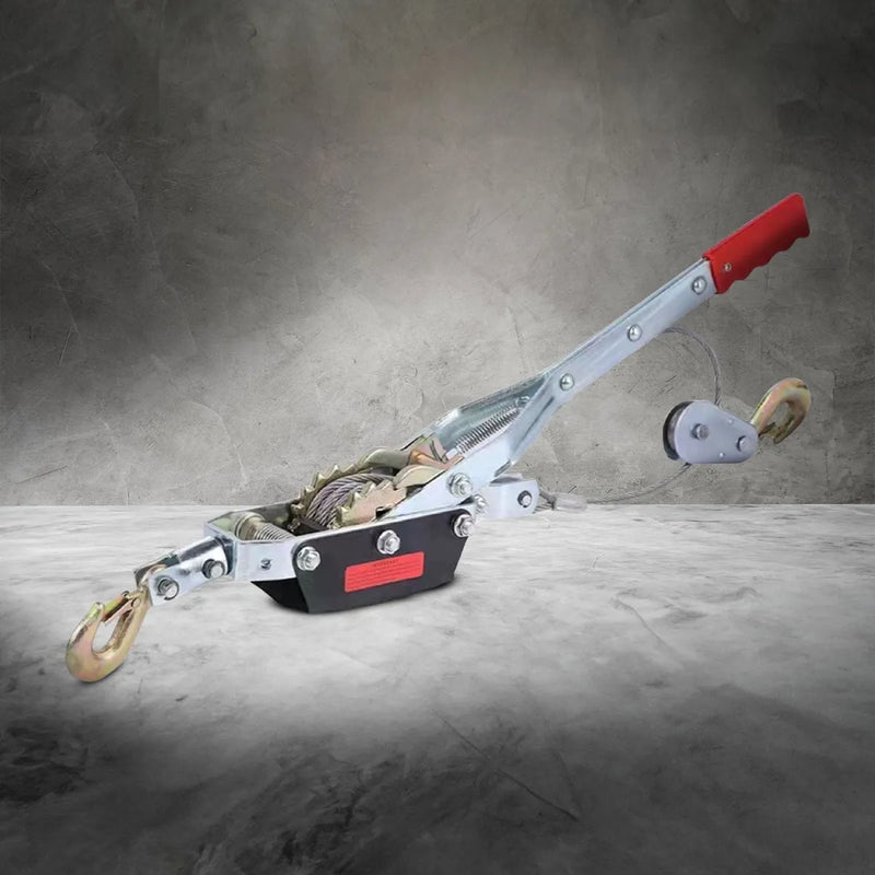 Hand winch puller with red handle and metal body for heavy-duty lifting and pulling