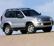 Silver Toyota Prado SUV with San Hima extendable towing mirrors on sandy surface