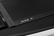 Black electronic device corner with AMD logo on ultra flex hard folding truck bed cover