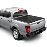 Silver pickup truck with ultra flex hard folding tonneau cover over truck bed