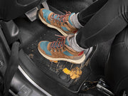 Colorful high performance hiking shoes on WeatherTech custom fit rear floor mats