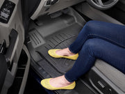 Yellow perforated flats in a car footwell showcasing WeatherTech high performance custom fit rear floor mats