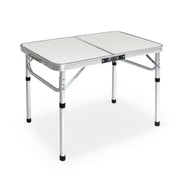 Portable folding camping table with adjustable aluminum legs and white top surface