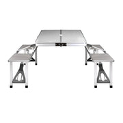Portable folding camping table with attached benches from Weisshorn for outdoor adventures