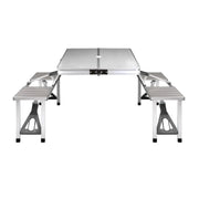 Portable folding camping table with attached benches from Weisshorn for outdoor adventures