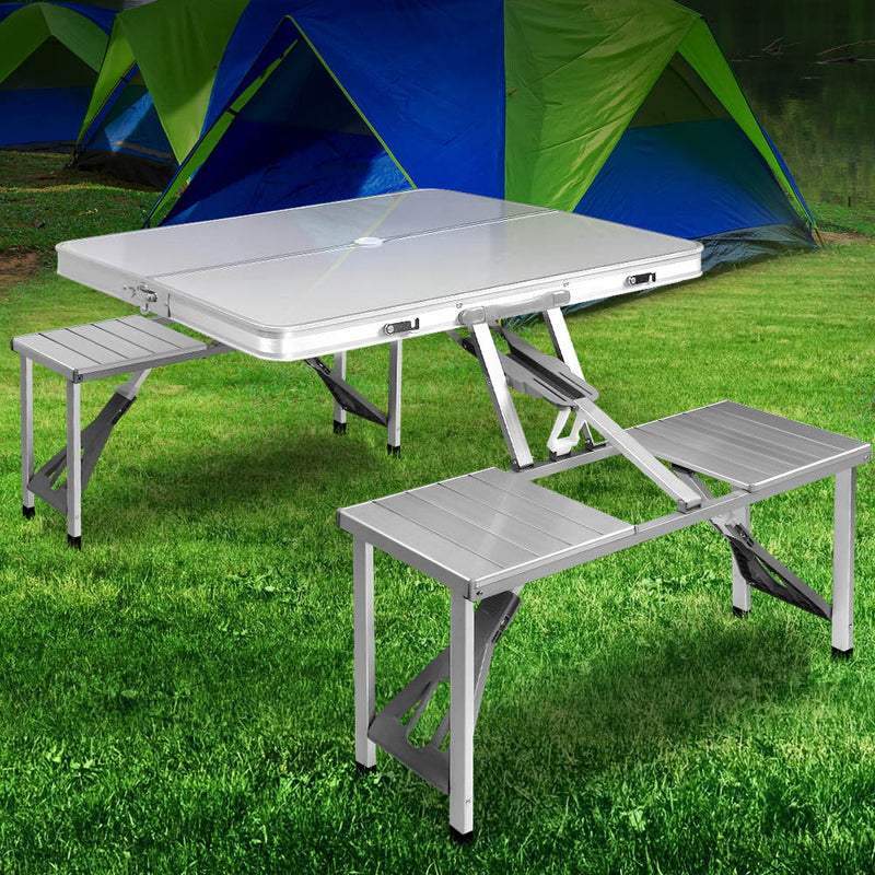 Portable folding camping table with attached bench seats for outdoor adventures